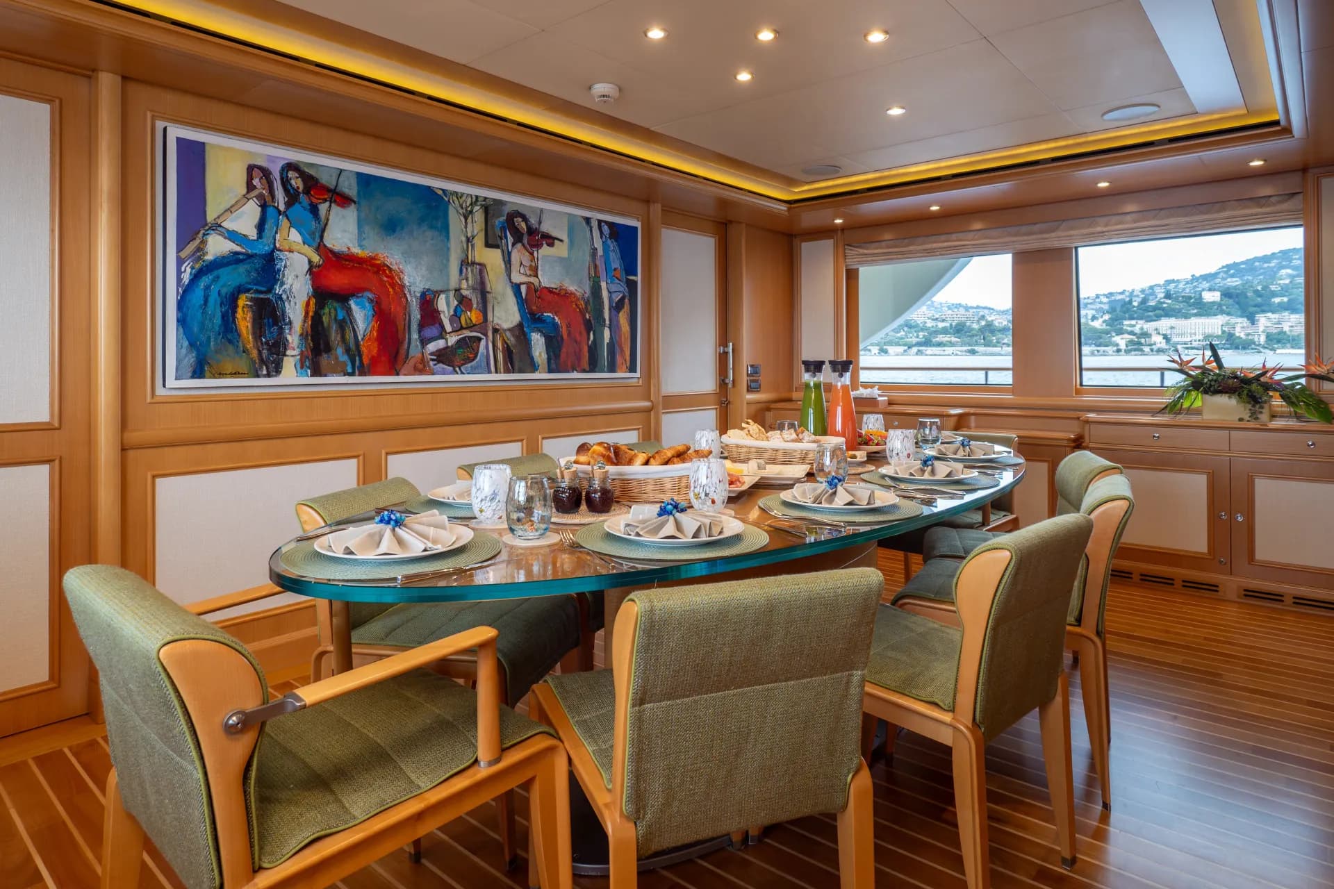 Formal dining set for guests beneath original artwork